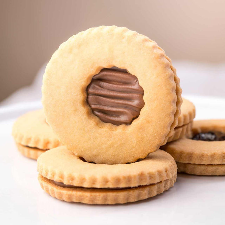 Occhi di Bue alla Crema Scura di Nocciola – Biscotti Artigianali Ripieni